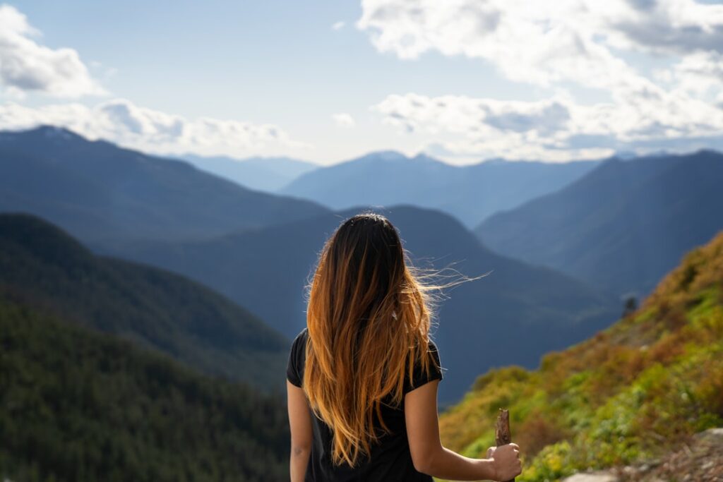 Fit woman overlooking a mountain landscape